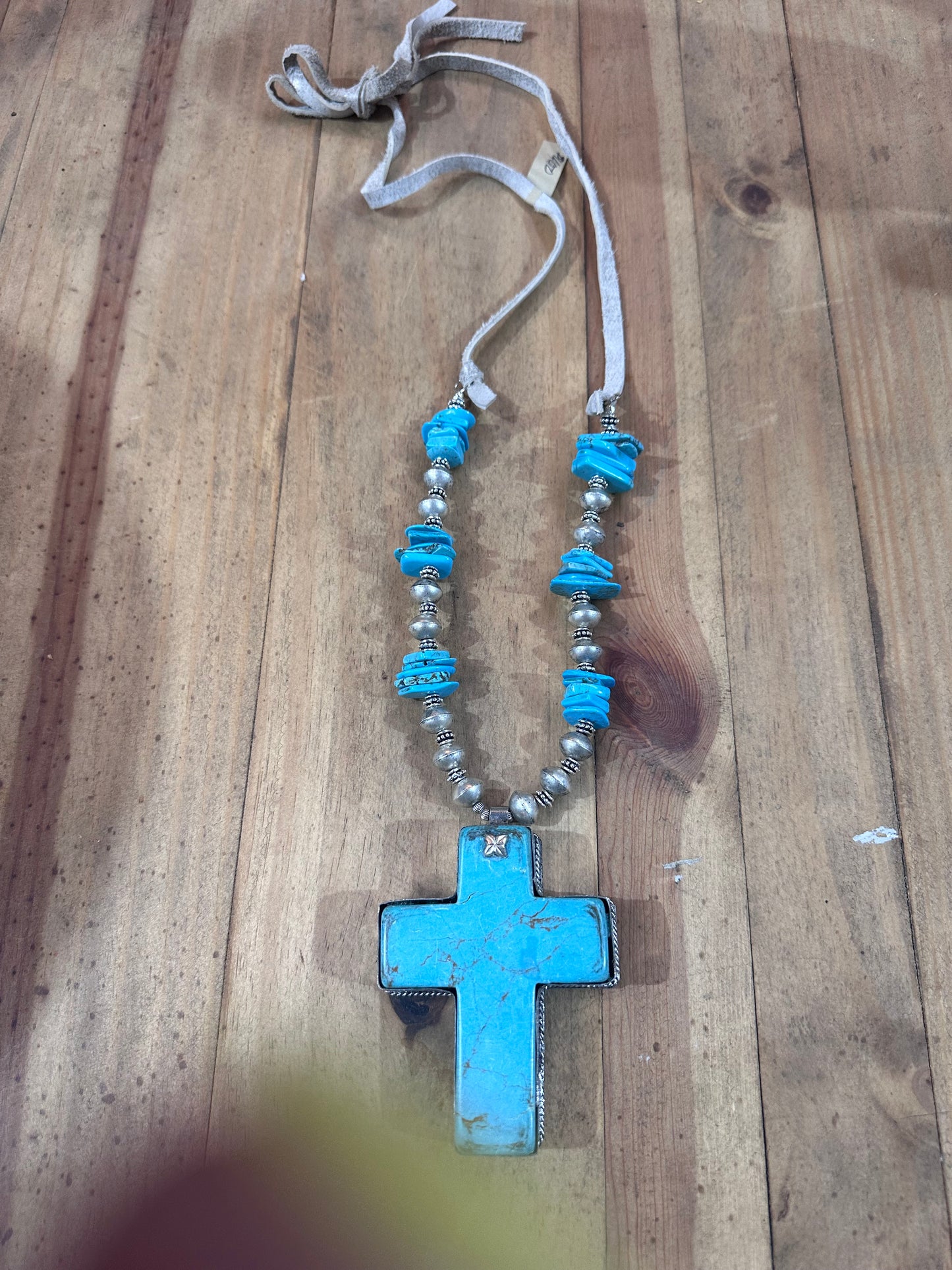 A rare bird cross necklace